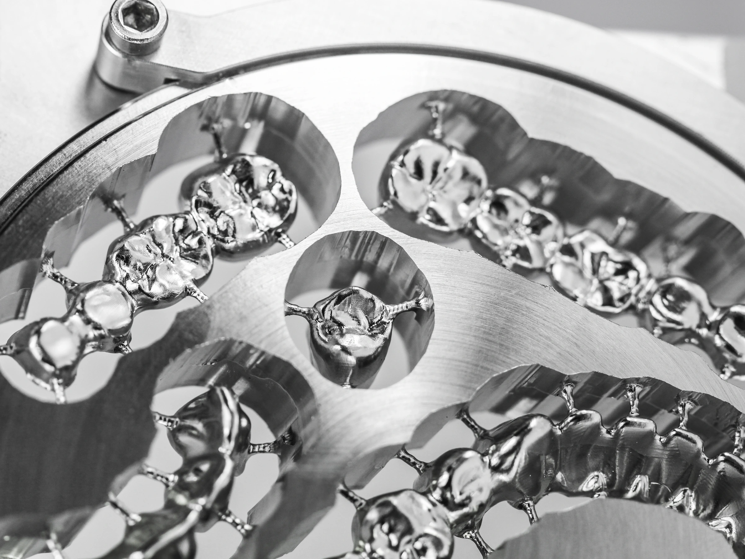 Metal dental restorations machined within a milling disc